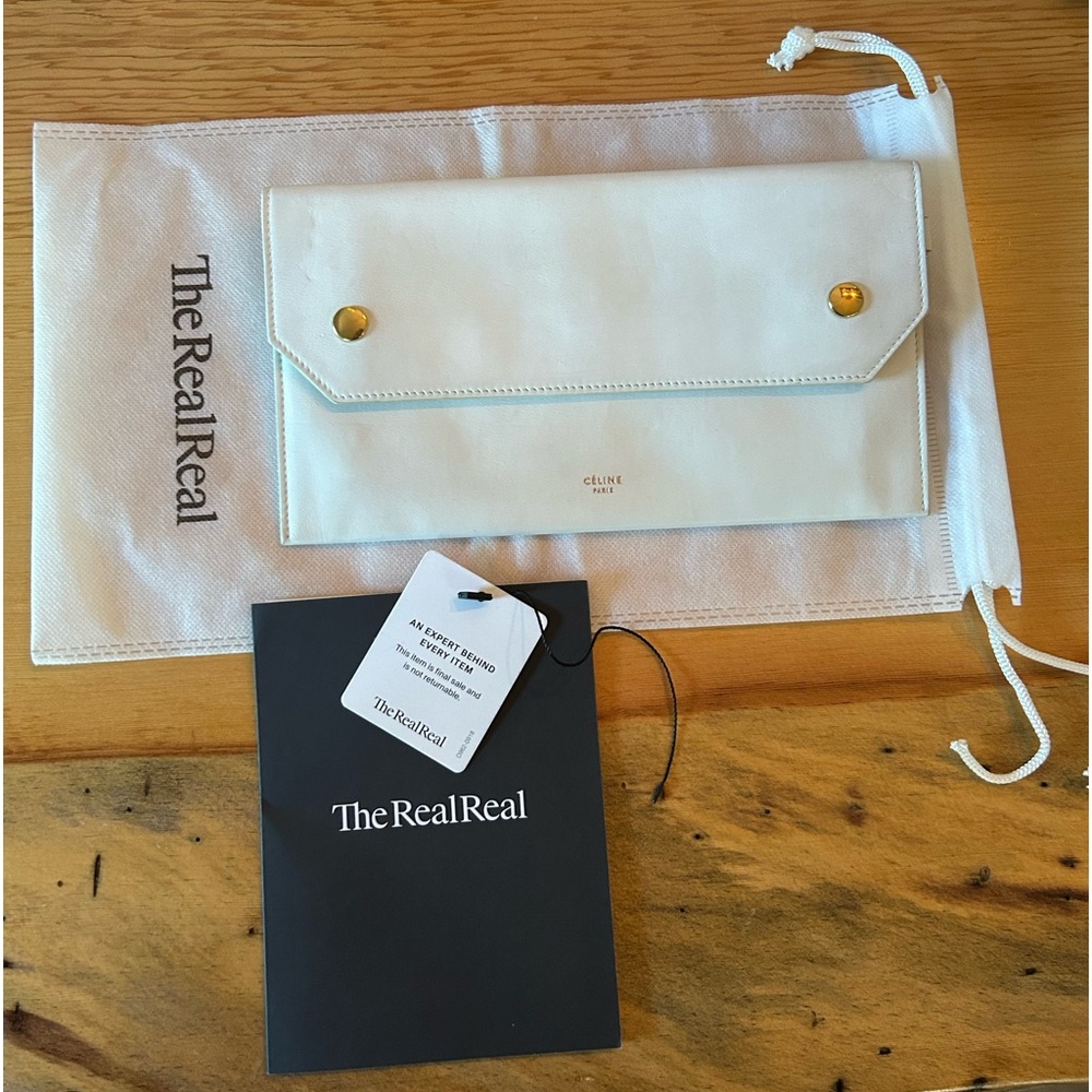 Celine smooth calfskin travel clutch in white. Lightly used.